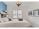 Guest bedroom with white bed frame and blue accent wall at 12432 Meadowlark Ln, Broomfield, CO 80021