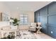 Home office with a desk, chair, and an accent wall at 12432 Meadowlark Ln, Broomfield, CO 80021