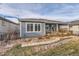 House exterior with a deck and landscaped backyard at 12432 Meadowlark Ln, Broomfield, CO 80021