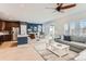 Open concept kitchen and living area with stainless steel appliances and island at 12432 Meadowlark Ln, Broomfield, CO 80021