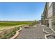 Backyard features a patio, a flower bed, a lawn area and views of the neighborhood at 15788 Valentia St, Thornton, CO 80602