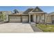 Charming home with stone accents, covered porch and an attached two car garage at 15788 Valentia St, Thornton, CO 80602