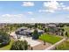 Spacious property aerial view showcasing the house, yard, and surrounding greenery at 6915 Tremolite Dr, Castle Rock, CO 80108