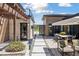 Beautifully landscaped backyard with stone walkway, dining area, and modern design at 6915 Tremolite Dr, Castle Rock, CO 80108