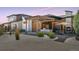 Inviting backyard patio area with pergola, outdoor fireplace, and dining space at 6915 Tremolite Dr, Castle Rock, CO 80108