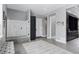 Modern bathroom with glass-enclosed shower, neutral color palette, and sleek fixtures and cabinetry at 6915 Tremolite Dr, Castle Rock, CO 80108