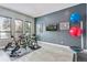 Home gym featuring modern fitness equipment, and an abundance of natural light at 6915 Tremolite Dr, Castle Rock, CO 80108