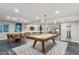 Basement game room featuring a pool table and adjacent bar area for entertaining at 6915 Tremolite Dr, Castle Rock, CO 80108