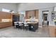 Large kitchen island featuring a breakfast bar and modern cabinetry, complemented by stainless steel appliances and high ceilings at 6915 Tremolite Dr, Castle Rock, CO 80108