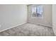 Bright room with neutral walls and plush carpet at 15047 E 50Th Dr, Denver, CO 80239