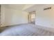 Bright and airy primary bedroom with high ceilings, neutral walls and carpet, with lots of natural light at 15976 Quarry Hill Dr, Parker, CO 80134