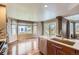 Bright eat-in kitchen featuring a large window and sliding glass door to the backyard, perfect for Gathering meals at 15976 Quarry Hill Dr, Parker, CO 80134