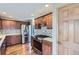 Modern kitchen with stainless steel appliances, granite countertops, wood cabinets, and tile backsplash at 15976 Quarry Hill Dr, Parker, CO 80134