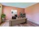 Bright home office featuring a desk, chair, bookshelf, and natural light, creating an efficient workspace at 15976 Quarry Hill Dr, Parker, CO 80134