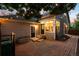 Private backyard patio perfect for outdoor entertaining with brick patio, planter box, and string lights at 1947 King St, Denver, CO 80204