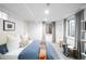 Bright basement bedroom with a comfortable bed and cozy decor at 1947 King St, Denver, CO 80204
