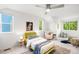 Bright bedroom with vaulted ceiling, white walls, and ample natural light from multiple windows at 1947 King St, Denver, CO 80204