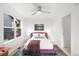 Cozy bedroom featuring a plush bed, large window, and contemporary decor at 1947 King St, Denver, CO 80204