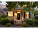Charming home with well-maintained landscaping and welcoming front porch at 1947 King St, Denver, CO 80204