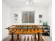 Finished basement game room with a foosball table for entertainment and recreation at 1947 King St, Denver, CO 80204