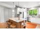 Beautiful kitchen with center island, stainless appliances, and eat-in breakfast bar at 1947 King St, Denver, CO 80204