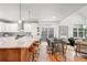 Open kitchen with sleek countertops, stainless steel appliances, and dine-in island at 1947 King St, Denver, CO 80204