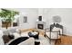 Bright living room features hardwood floors, a modern fireplace, lots of natural light, and a welcoming atmosphere at 1947 King St, Denver, CO 80204