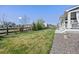 Spacious backyard with well-maintained lawn, wood fence, and mature landscaping at 806 Cabot Dr, Erie, CO 80516