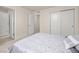 Well-lit bedroom featuring a walk-in closet and comfortable bed at 806 Cabot Dr, Erie, CO 80516