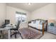 Comfortable bedroom with a daybed, desk, and ample natural light at 806 Cabot Dr, Erie, CO 80516