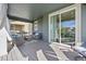 Spacious covered patio with seating and a sliding glass door leading inside at 806 Cabot Dr, Erie, CO 80516