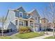 Inviting two-story home with a covered front porch and well-kept lawn and landscaping at 806 Cabot Dr, Erie, CO 80516