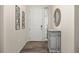 Foyer with wood floors, decorative cabinet, and stylish decor at 806 Cabot Dr, Erie, CO 80516