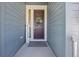 Close-up of a welcoming front door with a wreath and sidelight, enhancing curb appeal at 806 Cabot Dr, Erie, CO 80516