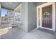 Cozy front porch featuring seating, a welcome sign, and a decorated front door at 806 Cabot Dr, Erie, CO 80516