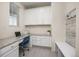 Functional home office features custom cabinets, granite countertops, and natural light from the window at 806 Cabot Dr, Erie, CO 80516