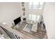 Open-concept living room showcases a fireplace, large windows, high ceilings, and stylish decor at 806 Cabot Dr, Erie, CO 80516