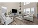 Spacious living room with a cozy fireplace, vaulted ceilings, and ample seating at 806 Cabot Dr, Erie, CO 80516