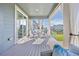 Inviting patio with comfortable seating and decorative drapes offering privacy and shade at 806 Cabot Dr, Erie, CO 80516