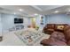 Finished basement featuring a comfortable leather couch and colorful rug at 5601 E Colorado Ave, Denver, CO 80224