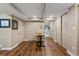 Finished basement with hardwood floors, office space, and multiple storage closets at 5601 E Colorado Ave, Denver, CO 80224