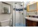 Stylish bathroom with tiled shower, vanity, and modern fixtures at 5601 E Colorado Ave, Denver, CO 80224