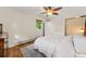 Bedroom with a ceiling fan, wood floors, and a dresser near the window at 5601 E Colorado Ave, Denver, CO 80224