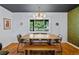 Dining room with a modern table, pendant lighting, and a window at 5601 E Colorado Ave, Denver, CO 80224