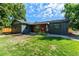 Charming single-story home with a well-manicured lawn and modern exterior accents at 5601 E Colorado Ave, Denver, CO 80224