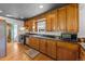 Charming kitchen with wooden cabinets, stainless appliances, and tile floors at 5601 E Colorado Ave, Denver, CO 80224