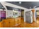 Spacious kitchen featuring a large island and stainless steel refrigerator at 5601 E Colorado Ave, Denver, CO 80224
