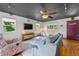 Cozy living room with natural light, sleek floors, and a colorful front door at 5601 E Colorado Ave, Denver, CO 80224