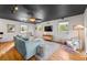 Bright living room with hardwood floors, a modern ceiling and comfortable, stylish furnishings at 5601 E Colorado Ave, Denver, CO 80224