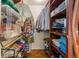 Spacious walk-in closet with custom wood shelving and storage solutions for organization at 5601 E Colorado Ave, Denver, CO 80224